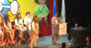 olga negron being awarded the Girl Scout take the lead award